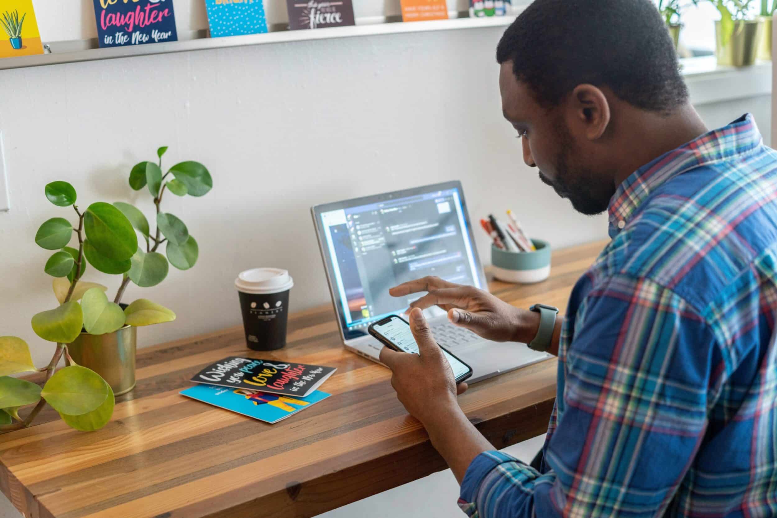 A person sitting in his workplace and doing email marketing in ecommerce