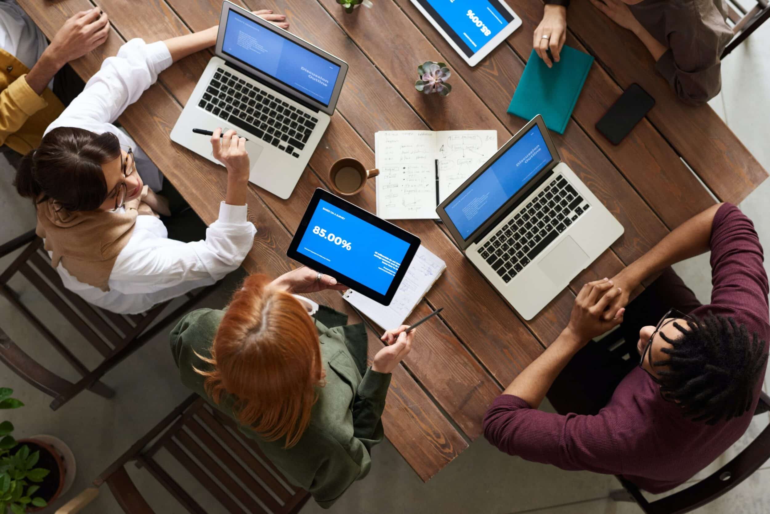 Team discussing about managing a remote web development team